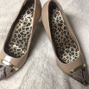 Nude and snake skin heels.